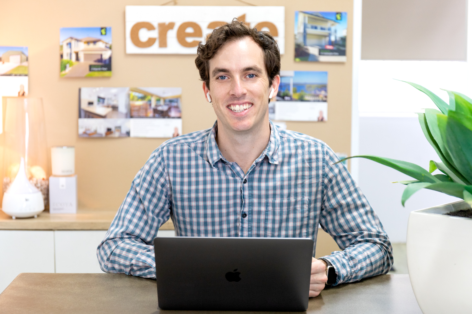 Angus working at a desk with a laptop